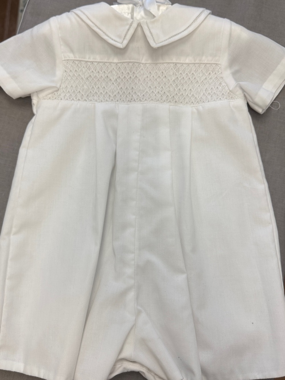 Petit Ami White Smocked Infant Romper with Peter Pan Collar